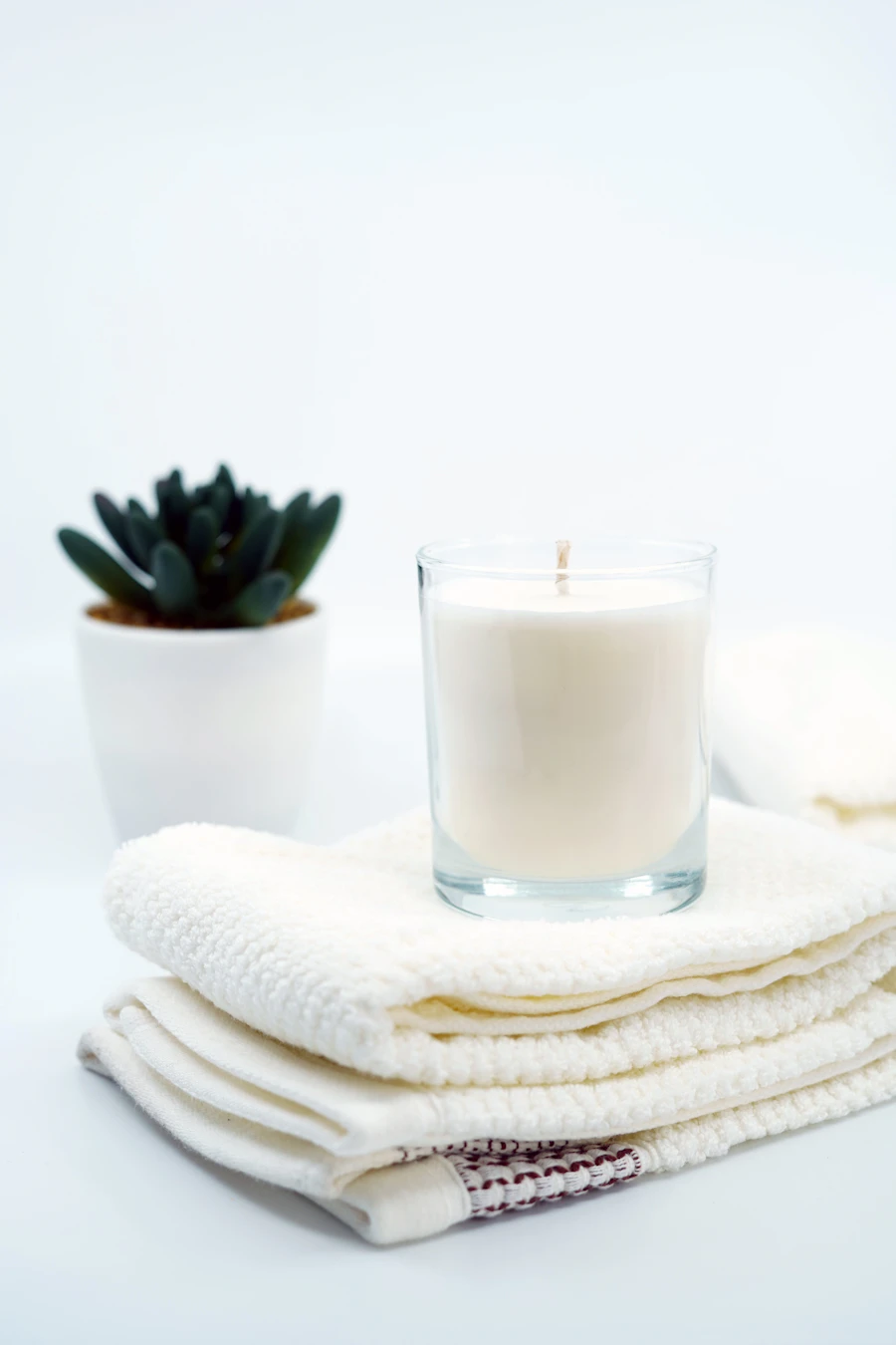 Fresh towels and calming spa ambience prepared for a private luxury massage session at home